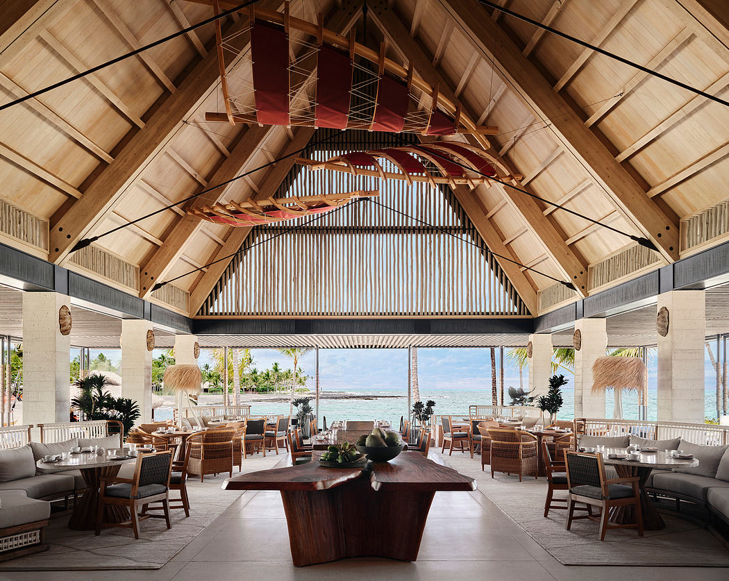 Spacious, open-air restaurant with vaulted wooden roof, exposed beams, and tropical decor.