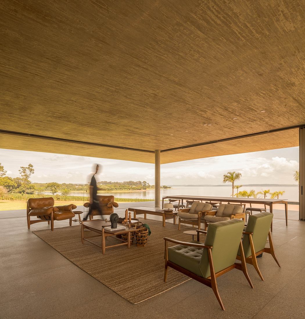 Cozy lounge area with stunning lake view and mid-century modern furniture.