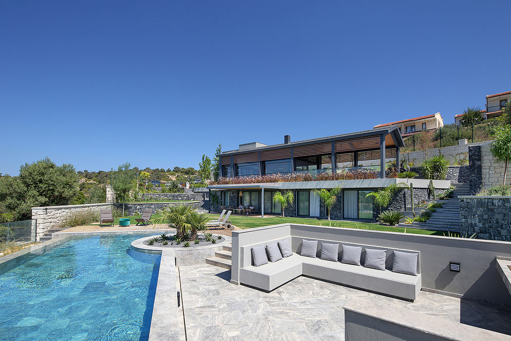 Striking contemporary villa with sleek outdoor living area and serene pool.