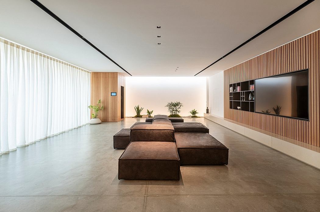 Spacious modern living room with clean lines, wooden accents, and plush seating arrangements.