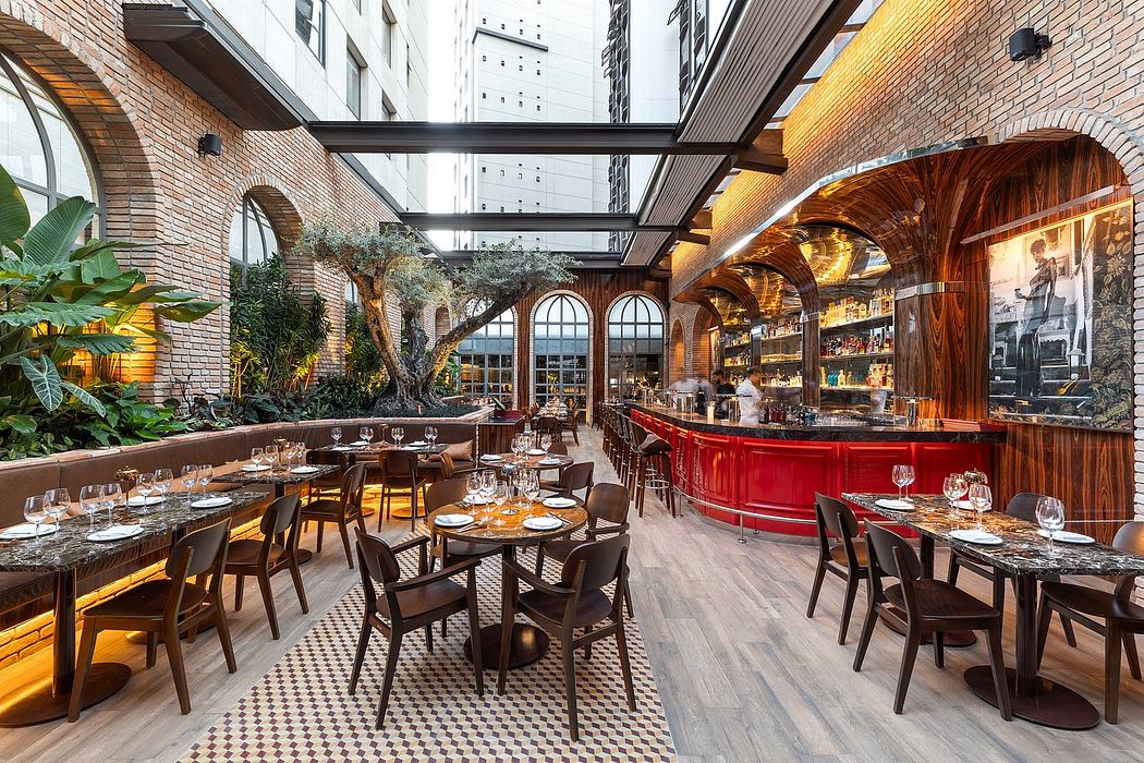 Stunning restaurant interior with brick arches, wood accents, and a striking red bar.