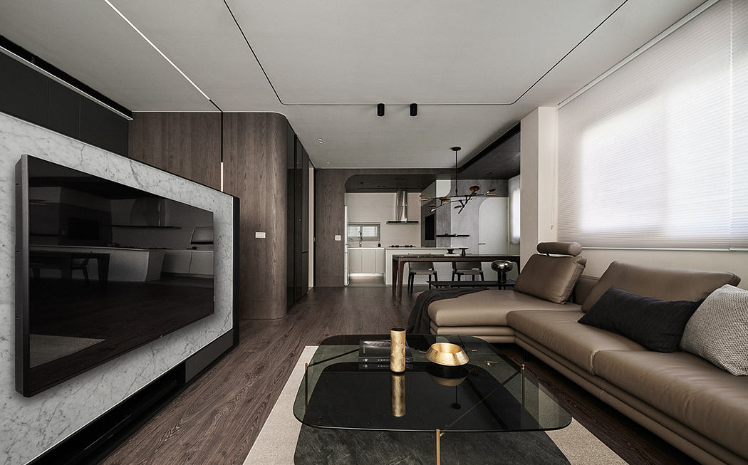 Sleek, modern living room with dark wood paneling, marble accents, and minimalist furnishings.