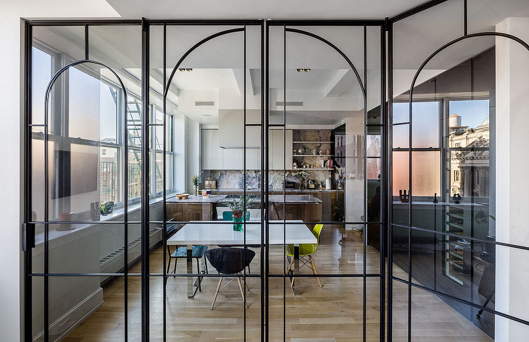 Modern architectural design with glass partitions, arched doorways, and open kitchen.