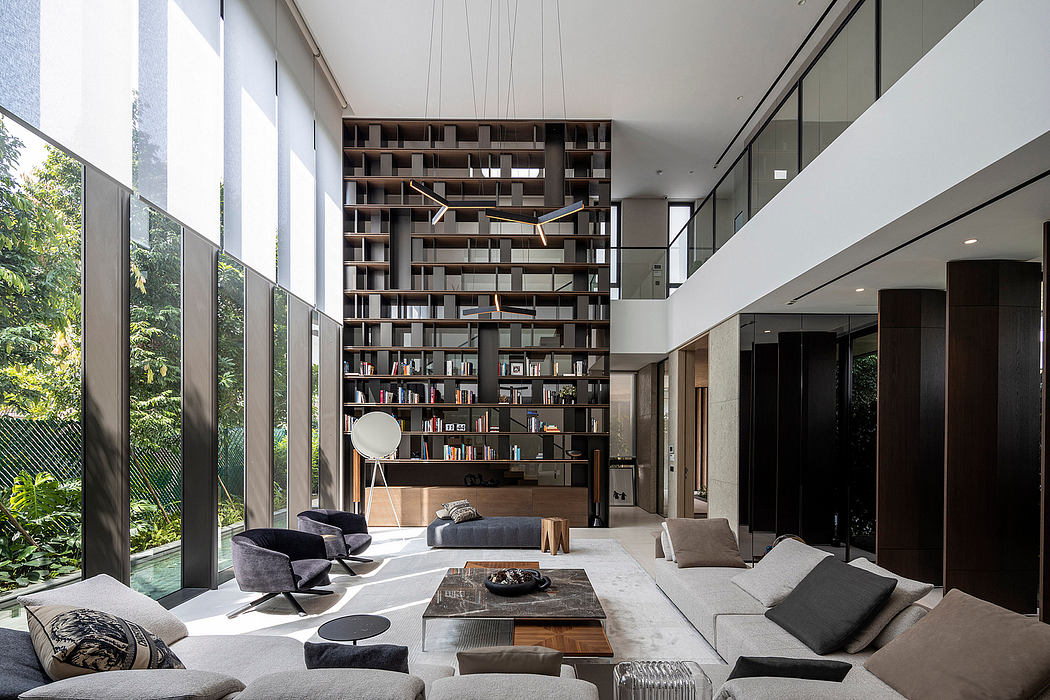 Expansive modern living room with floor-to-ceiling bookshelves, glass walls, and plush seating.