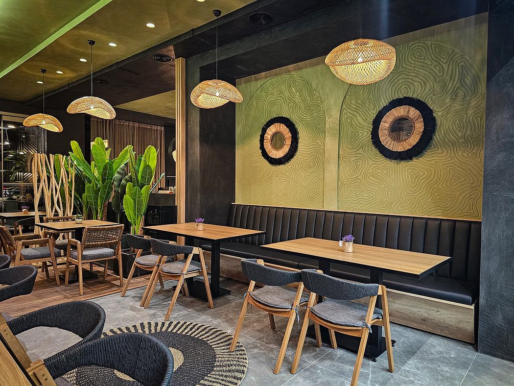 Contemporary cafe with rattan pendant lights, graphic wall art, and plush banquette seating.