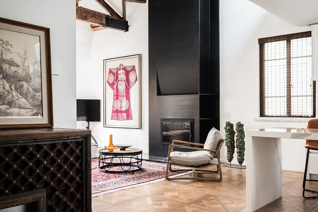 This interior features a mix of modern and rustic elements, including exposed beams, a pink framed artwork, and a tufted leather couch.