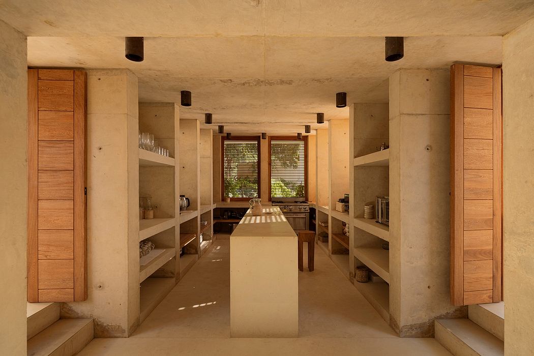 Minimalist concrete dining space with wooden shelving and lighting fixtures.