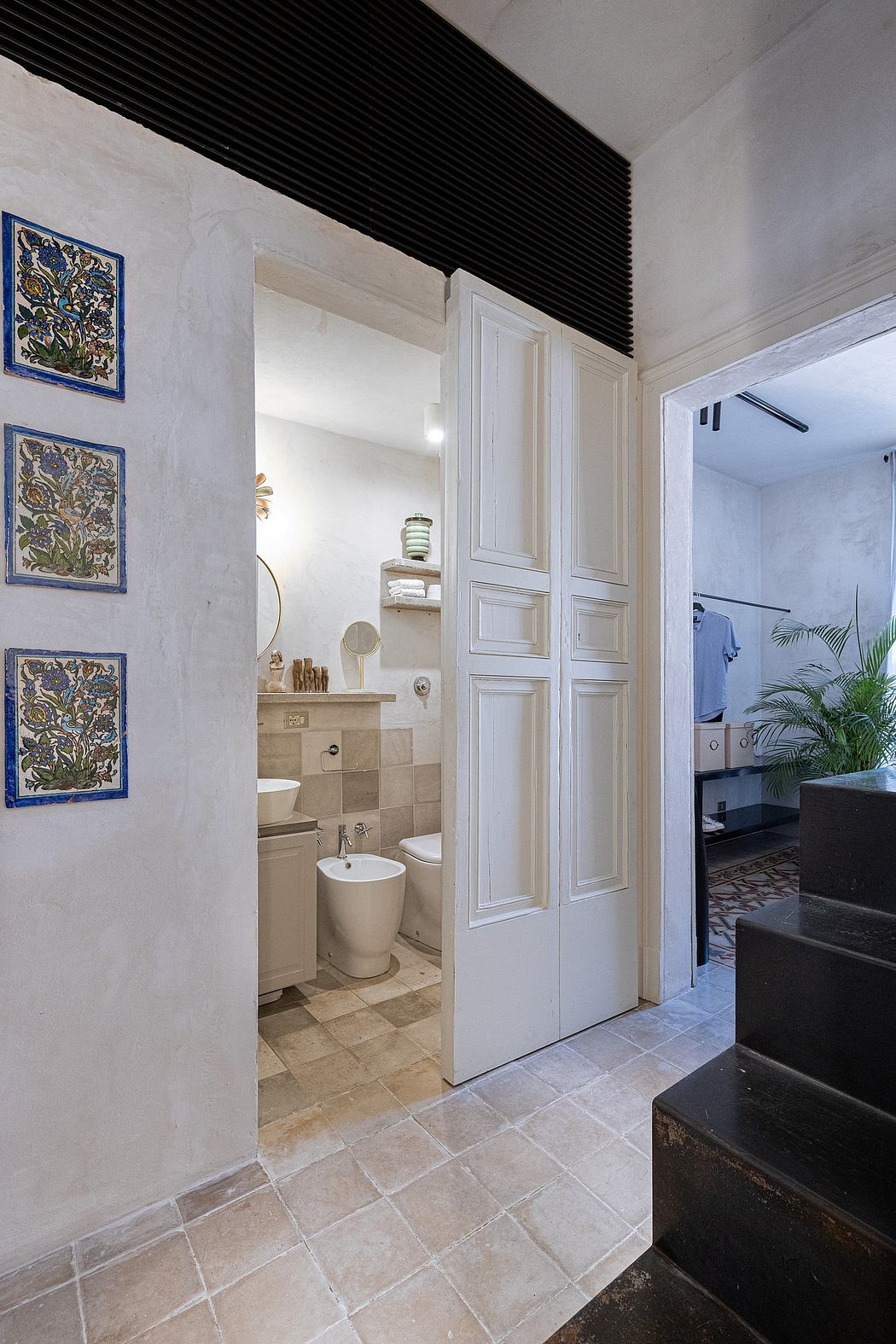 Elegant tile flooring, ornate ceramic wall tiles, and a sleek, modern bathroom design.