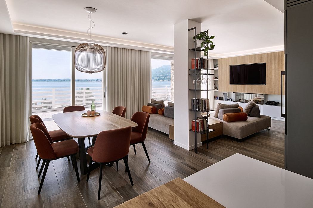 A modern, open-concept living space with a dining area, comfortable seating, and natural lighting.