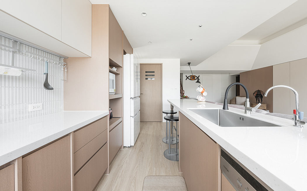 A contemporary kitchen with sleek cabinets, minimalist decor, and a spacious layout.