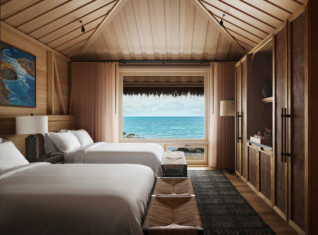 Rustic yet luxurious overwater villa with wooden beams, ocean view, and textured furnishings.