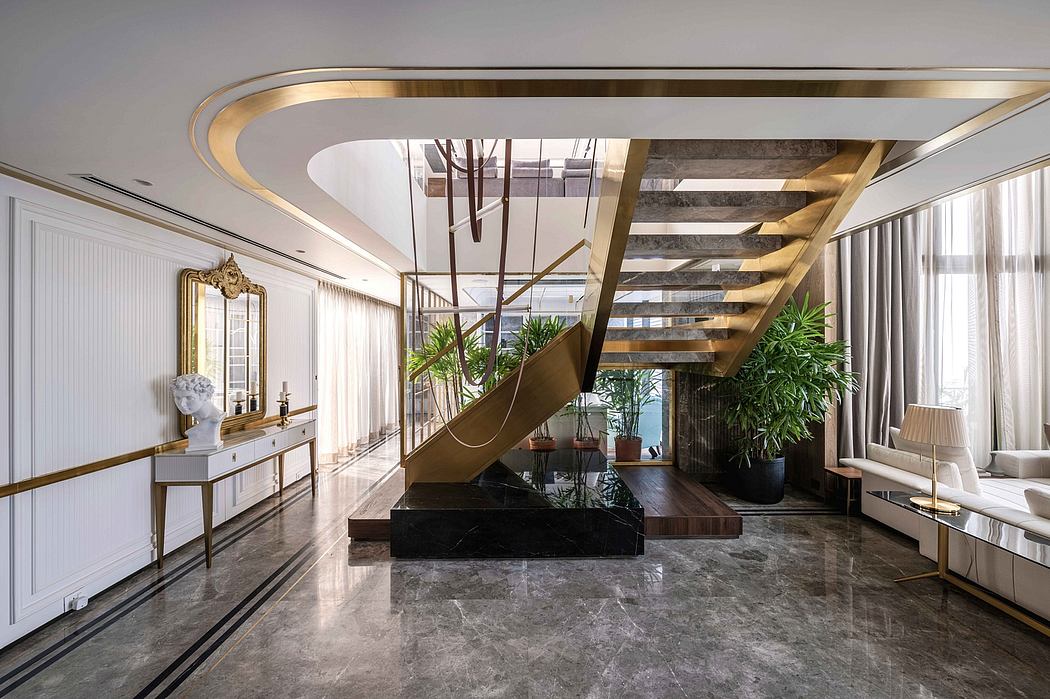Luxurious modern interior with marble floors, gold accents, and a striking sculptural staircase.