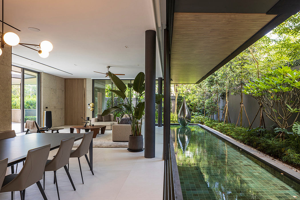 Elegant modern interior with lush greenery, reflecting pool, and modern lighting fixtures.