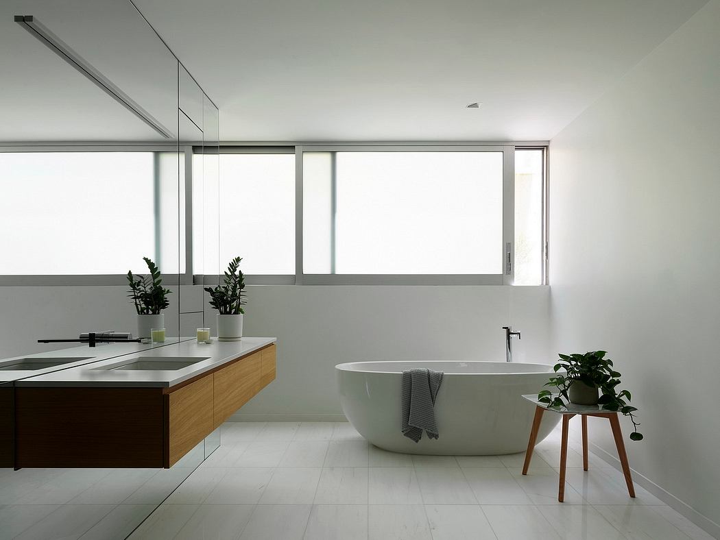 Spacious modern bathroom with sleek fixtures, minimalist decor, and abundant natural light.