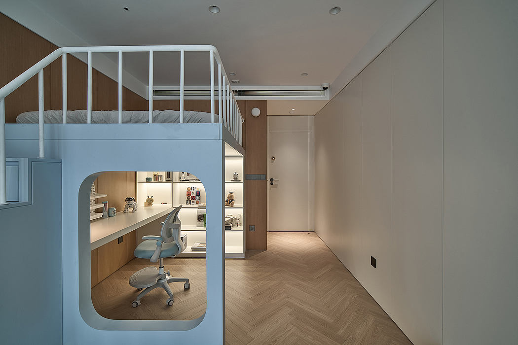 A modern studio apartment with a loft bed, workspace, and minimalist decor.