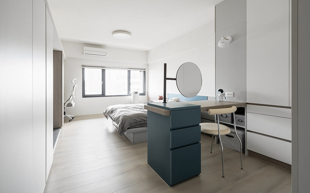 A minimalist, well-lit bedroom with sleek furniture, ample storage, and a modern aesthetic.