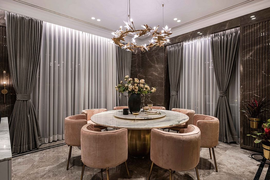 Luxurious dining room with marble-topped round table, plush velvet chairs, and gold-accented chandelier.