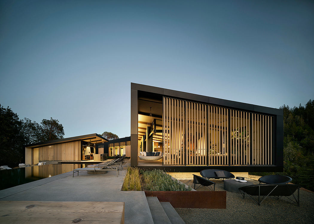 Contemporary modular architectural design with wooden facade, outdoor patio, and reflective pool.