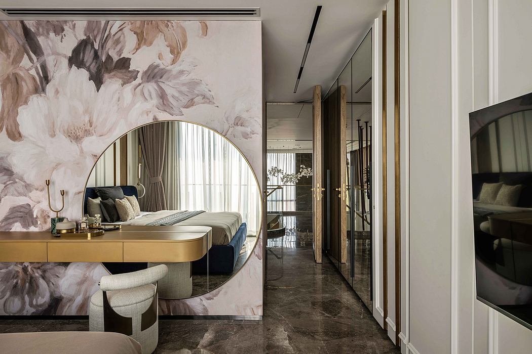 Luxurious bedroom with plush upholstery, ornate mirror, and marble flooring creating an elegant ambiance.