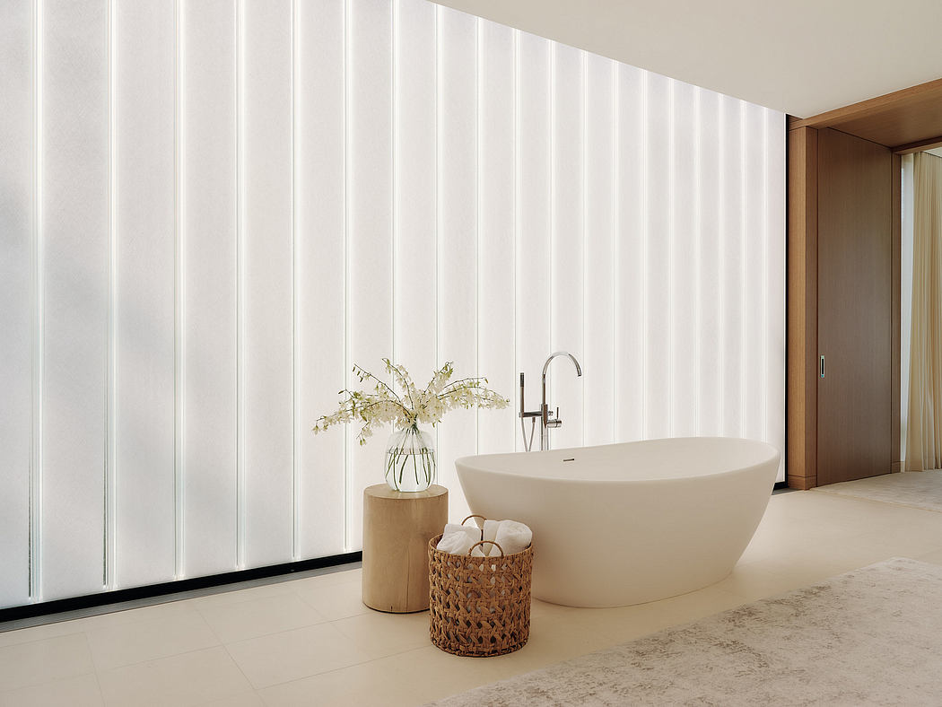 Sleek, minimalist bathroom with freestanding tub, wooden accents, and vertical paneling.