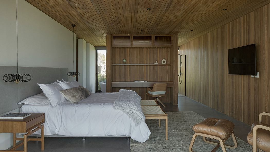 Warm, cozy bedroom with wooden paneling, built-in cabinetry, and muted color palette.