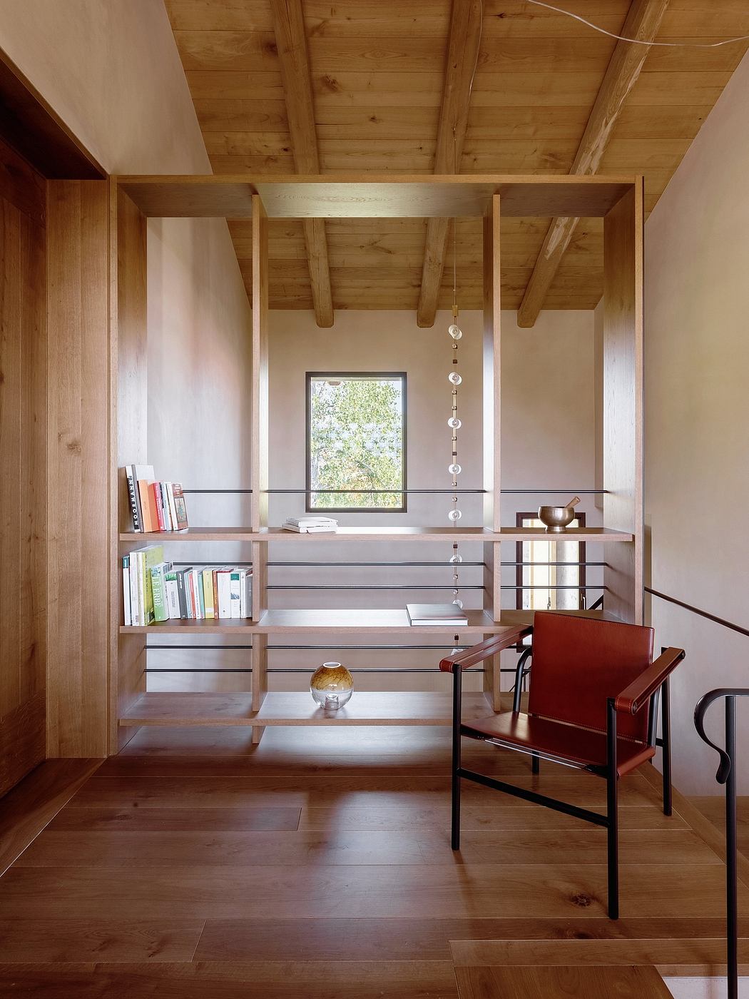 Rustic wooden beams and shelves create a warm, modern workspace with ample storage.