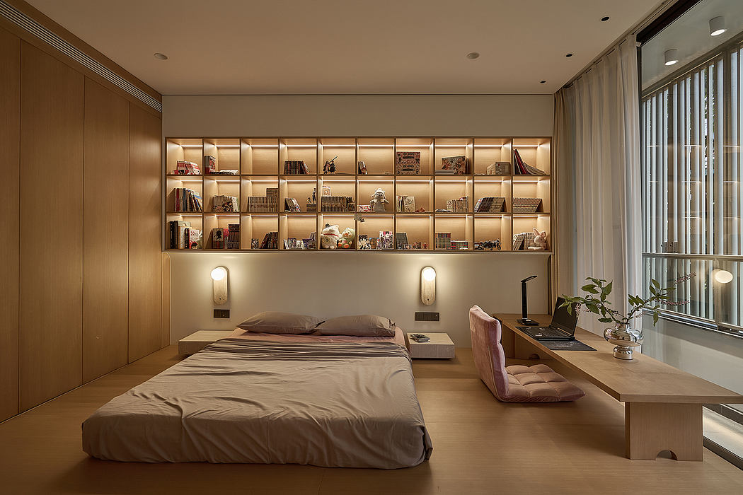 Cozy bedroom with warm wood paneling, built-in shelves, and plush seating area.