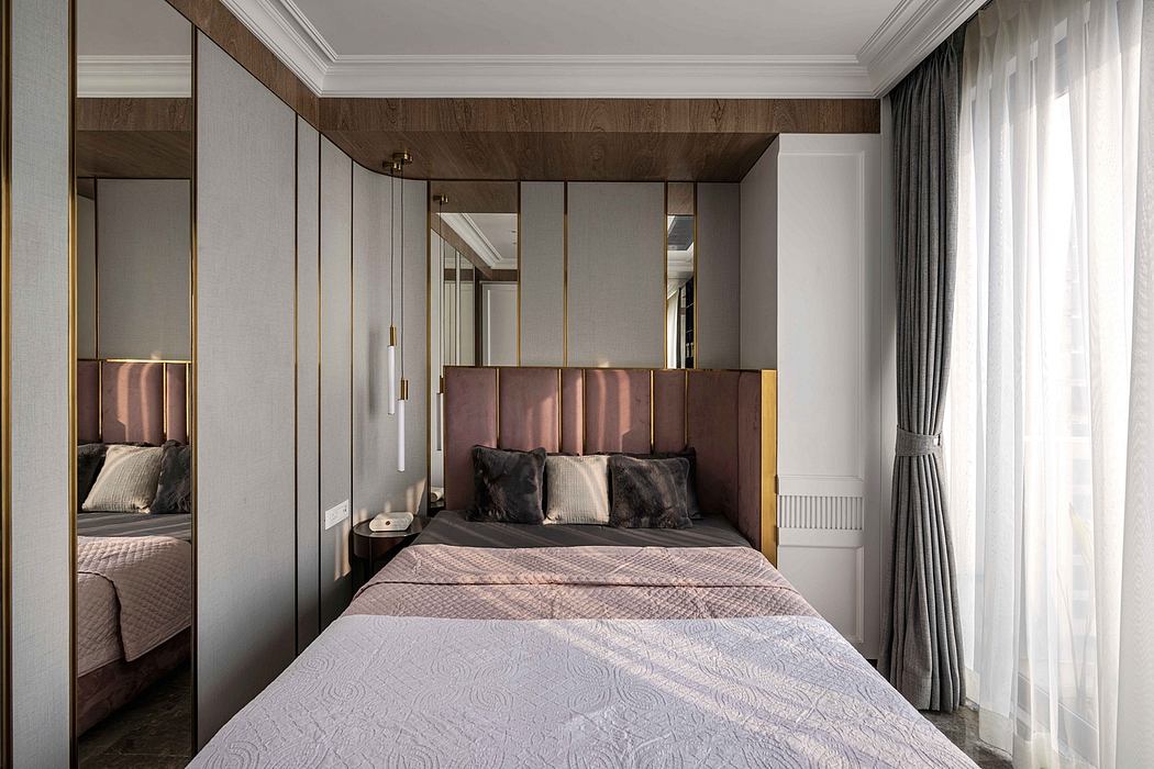 Sophisticated bedroom design featuring wooden paneling, plush headboard, and tall mirrored wardrobes.