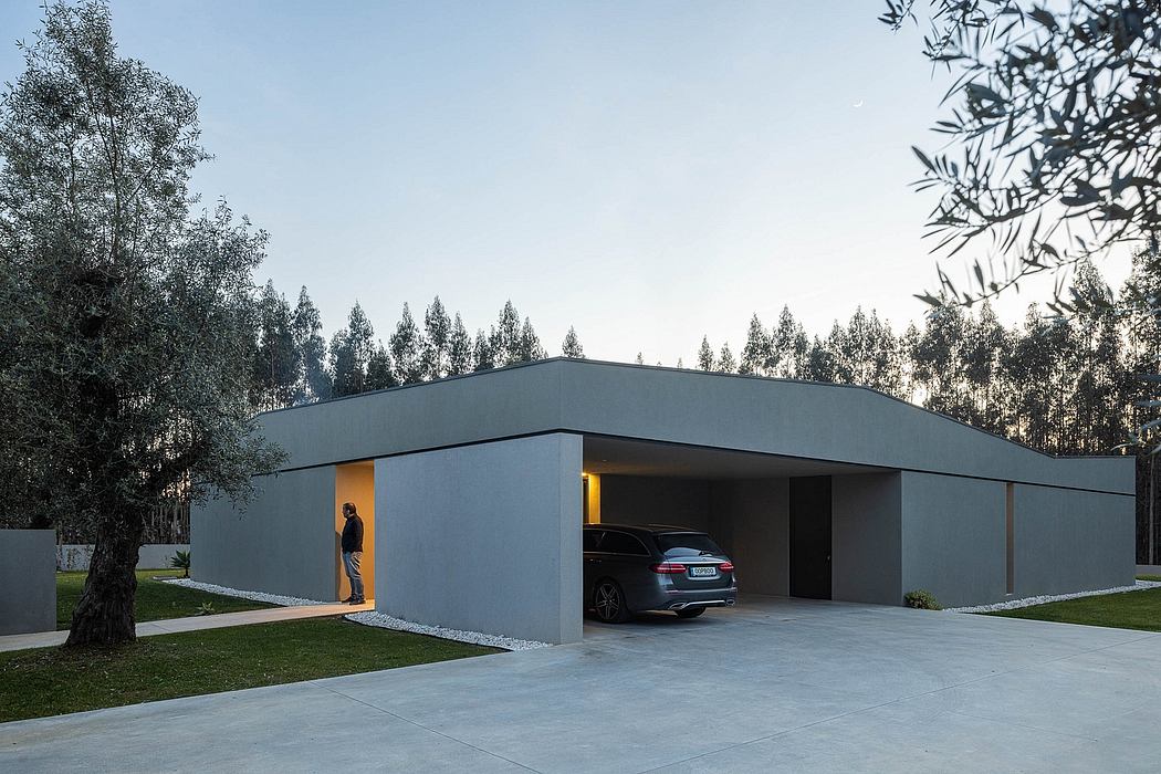 Modern minimalist carport with sleek, angular design and recessed lighting.