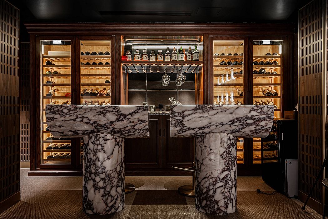 Luxurious bar interior with marble countertops, wooden shelves, and a well-stocked liquor display.