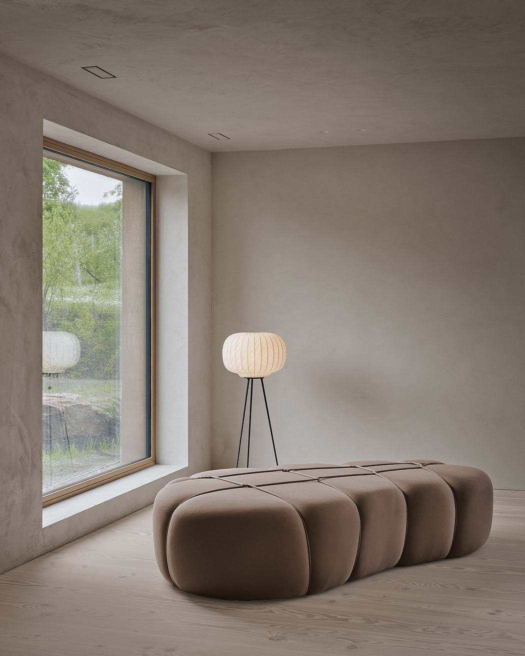 Minimalist living room with large window, plush sofa, and pendant lighting.