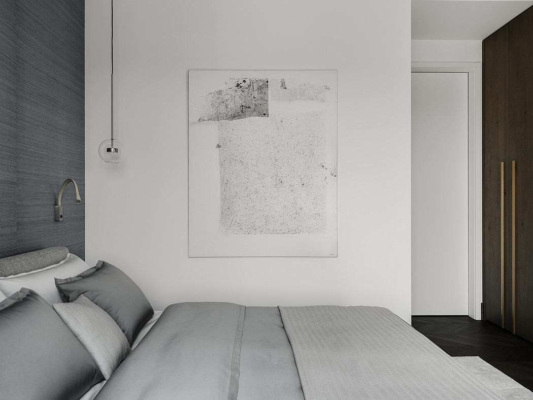 Clean, minimalist bedroom design with abstract artwork, modern furniture, and neutral color palette.