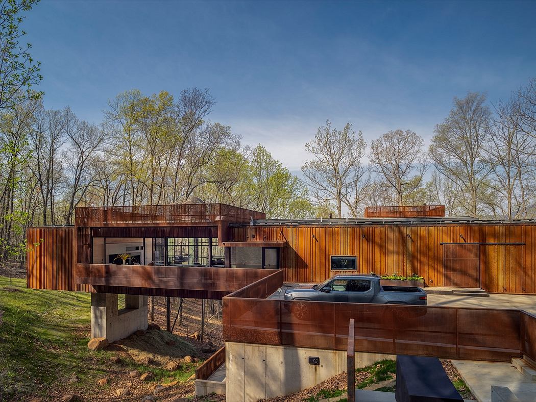 Striking modern architecture with rustic wooden siding and expansive glass walls.