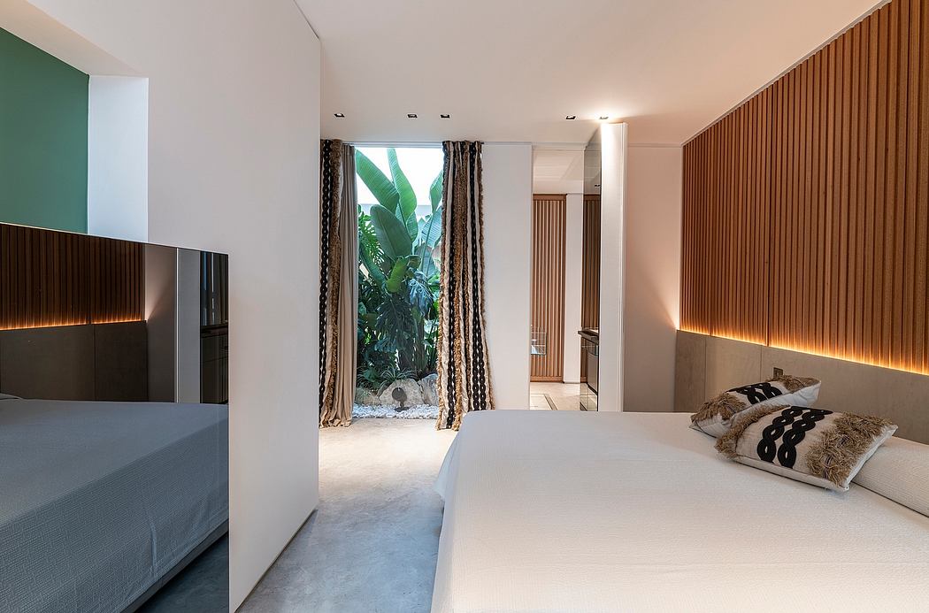 Minimalist bedroom with large window, warm lighting, and modern wooden wall paneling.