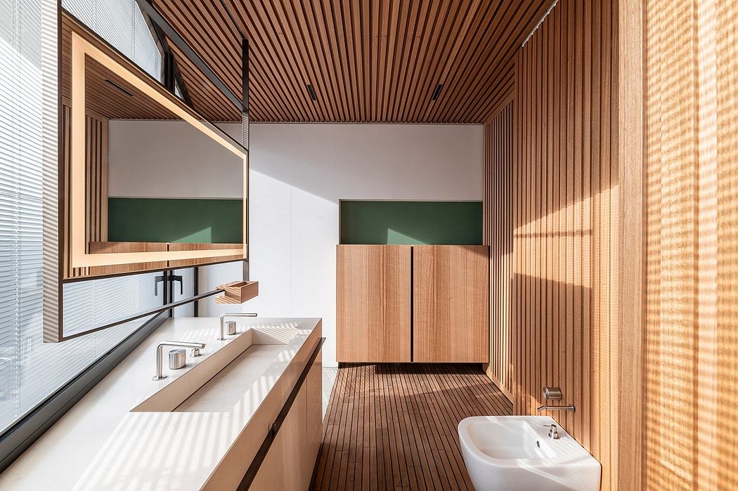 Elegant minimalist bathroom design with wooden paneled walls and modern fixtures.