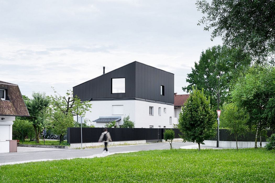 scalloped shingles and timber screens wrap modern austrian home by MWarchitekten