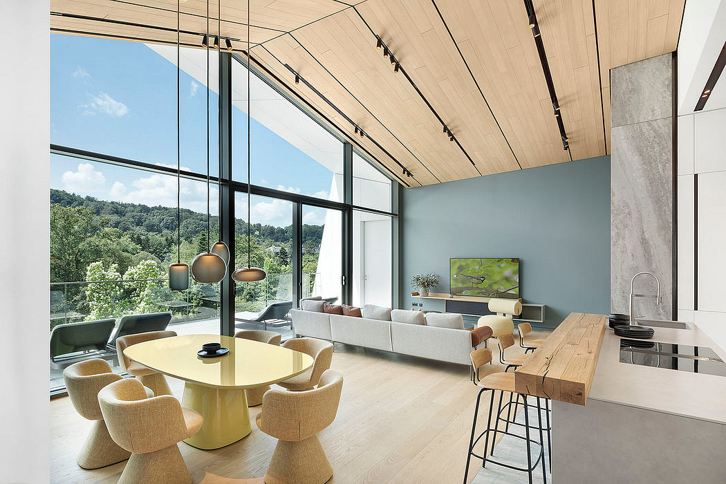 Expansive glass walls, warm wood accents, and modern furnishings create a serene living space.