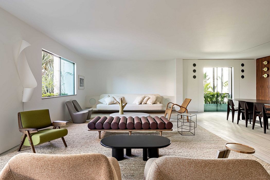 Expansive open-concept living space with midcentury-inspired furniture and decor.