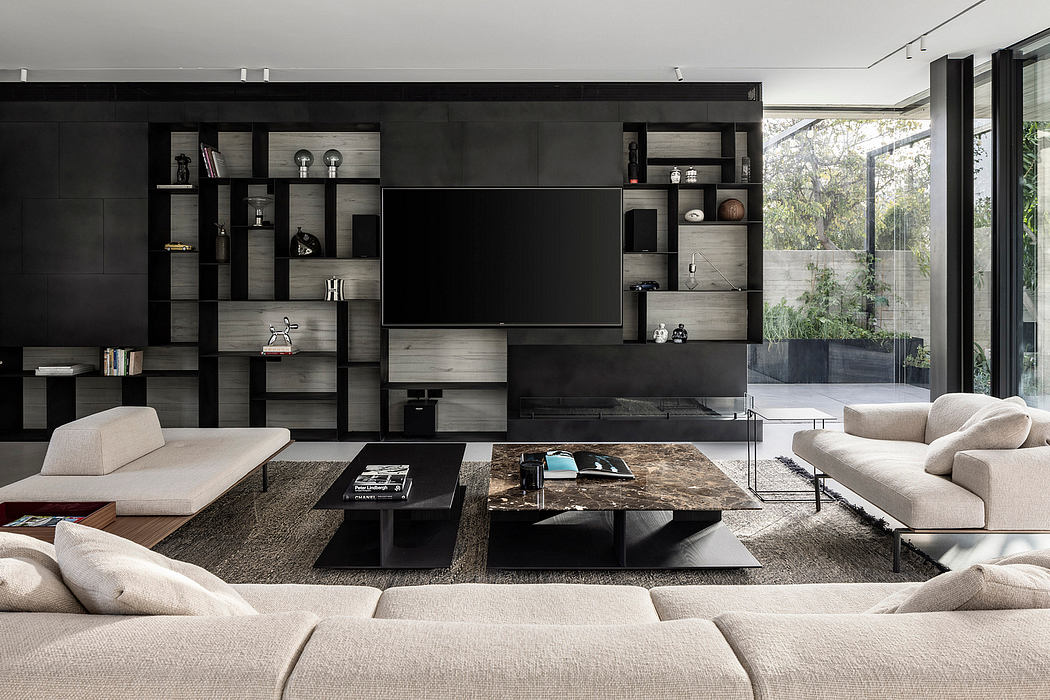 Sleek, modern living room with dark cabinetry, plush beige sofas, and a marble-topped coffee table.