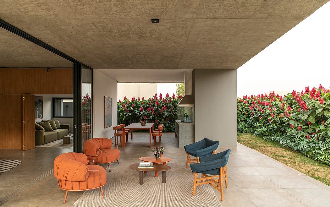 Striking modern patio with vibrant plant life, plush seating, and minimalist furnishings.