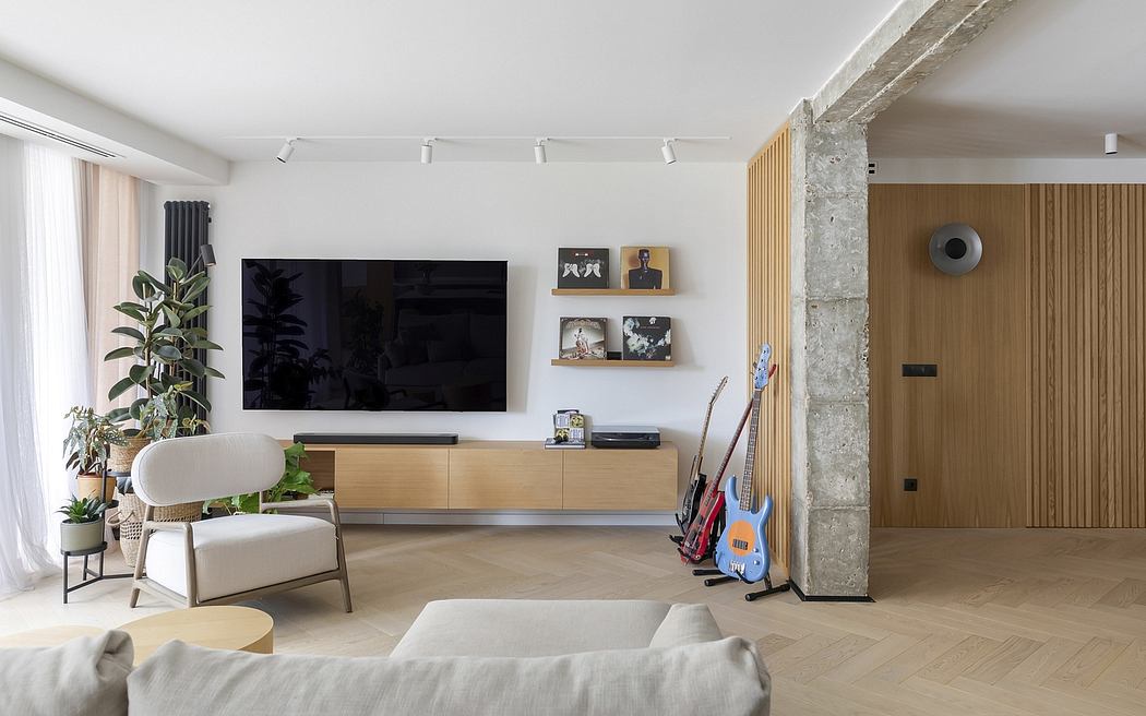 Minimalist living room with wood and stone accents, floating TV console, and indoor plants.