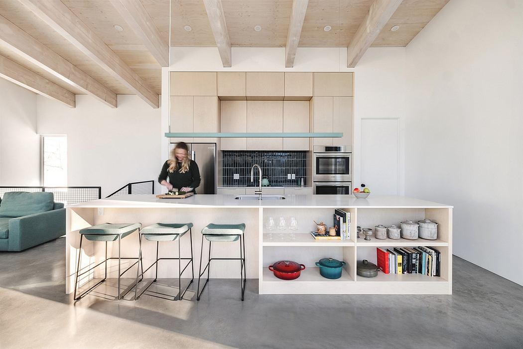 Spacious, modern kitchen with natural wood beams, clean lines, and open shelving.