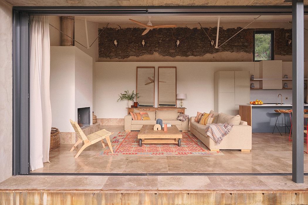 A cozy living space with rustic stone walls, warm lighting, and a mix of modern and natural furnishings.