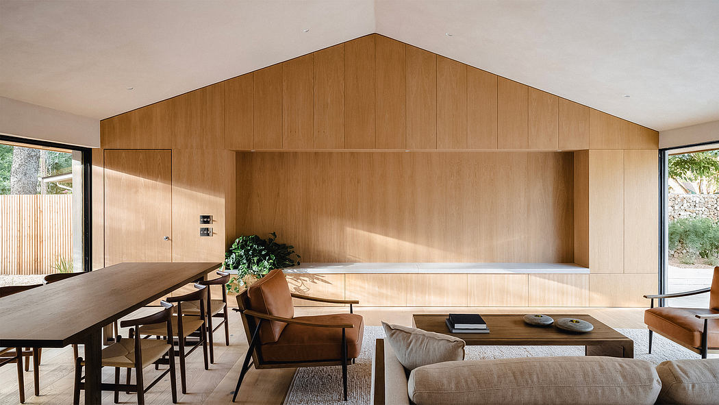 Elegant wood-paneled interior with minimalist furniture, open plan living and dining.