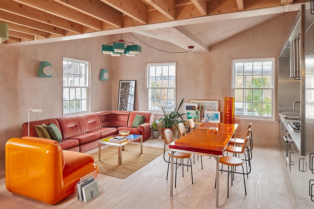 Warm, cozy living space with wooden beams, colorful furniture, and large windows.