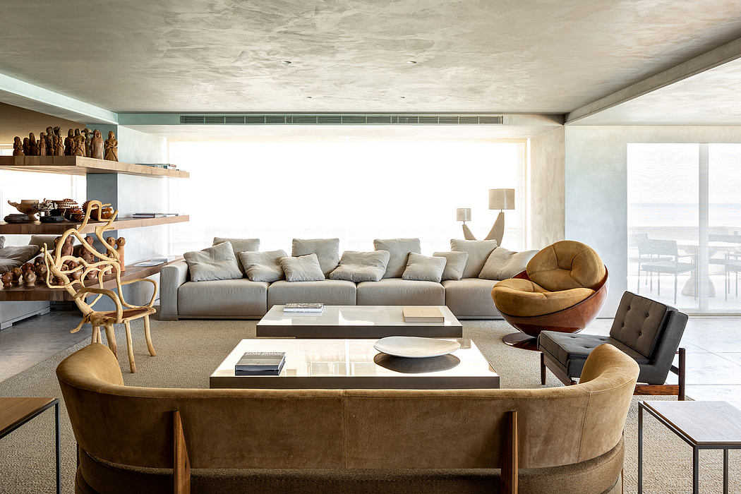 Spacious living room with minimalist furniture, wooden shelves, and textural accents.