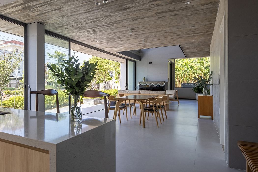 Spacious modern interior with clean lines, large windows, and natural materials.