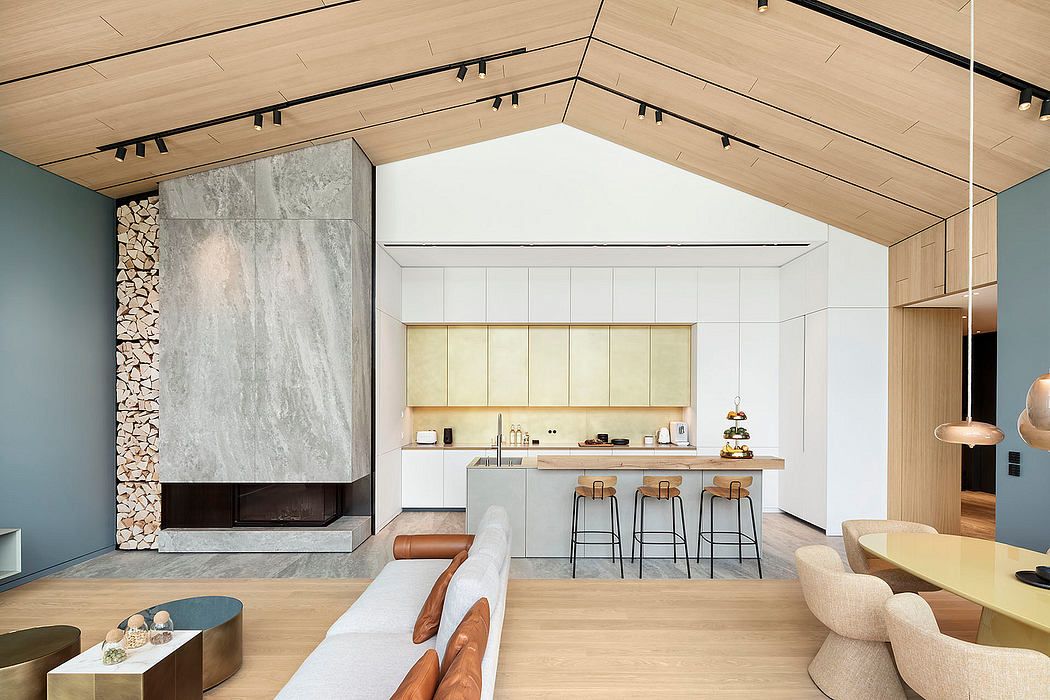 Spacious open-concept kitchen with wooden beams, modern fireplace, and minimalist decor.