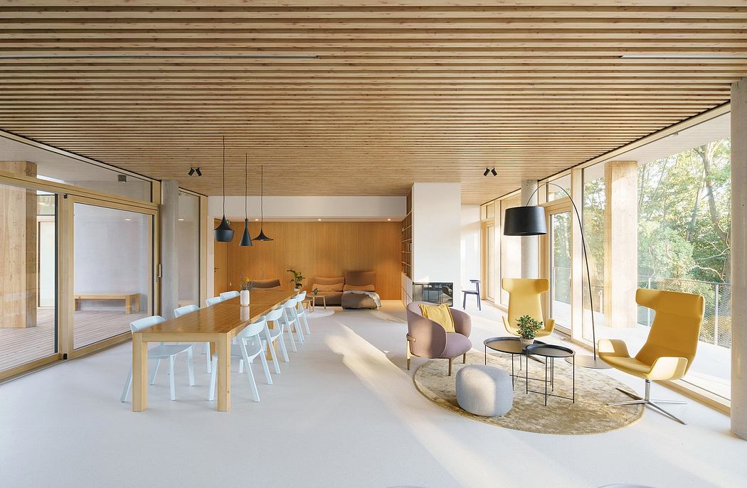 Extensive use of wood paneling and modern furniture create a warm, inviting space.