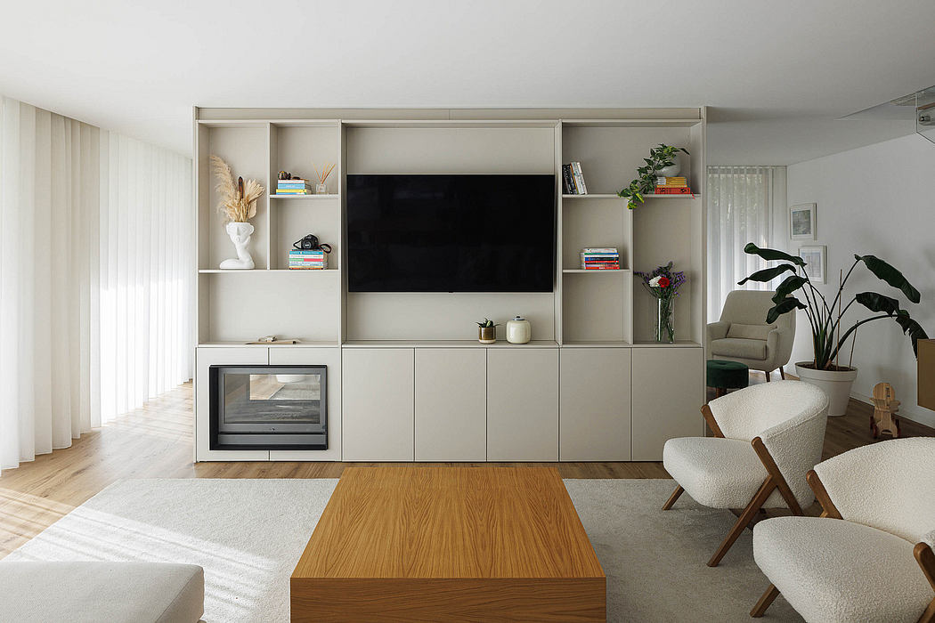 A modern, minimalist living room with a sleek entertainment unit, potted plants, and natural wood accents.